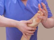 Doctor Holding Patient's Foot