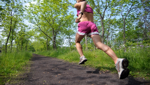 Woman Runner on Wooded Trail