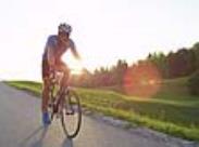 cyclist riding with sunlight