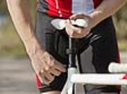 man adjusting his bike saddle