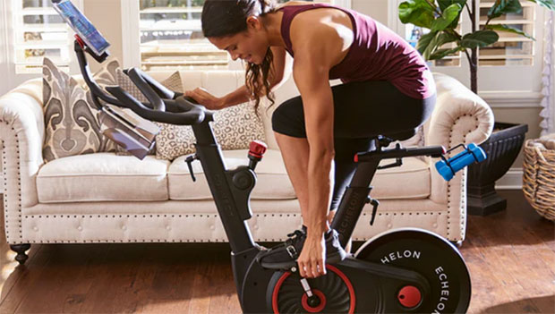 woman adjusting exercise bike