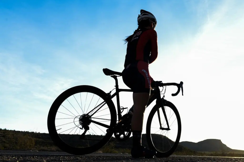 Woman Cycling at Dusk
