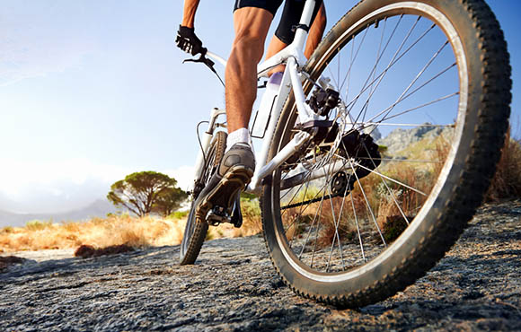 riding mountain bike on pavement