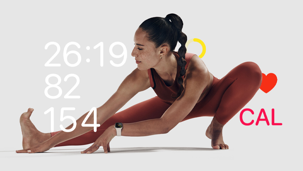 woman stretching via Apple Fitness Plus