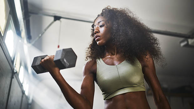 woman lifting a dumbbell