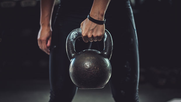 person holding a kettlebell