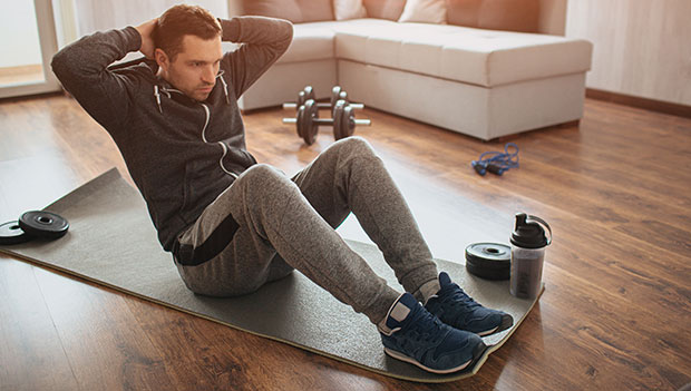 man working out in living room