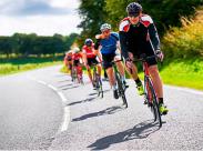group-of-bicyclists-on-a-rural-road-front