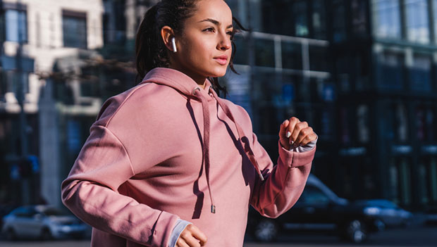 woman running with earbuds