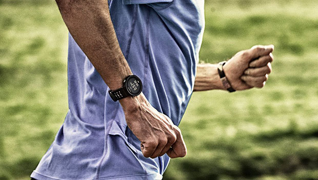 man running with a garmin watch