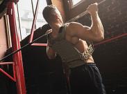 man-doing-pull-ups-with-a-weighted-vest