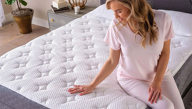 woman feeling a mattress