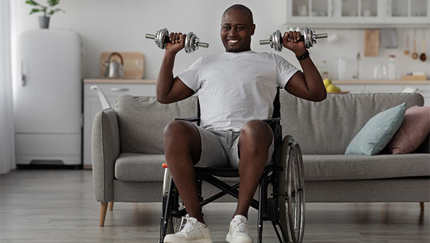 man-in-wheelchair-doing-dumbbell-shoulder-press