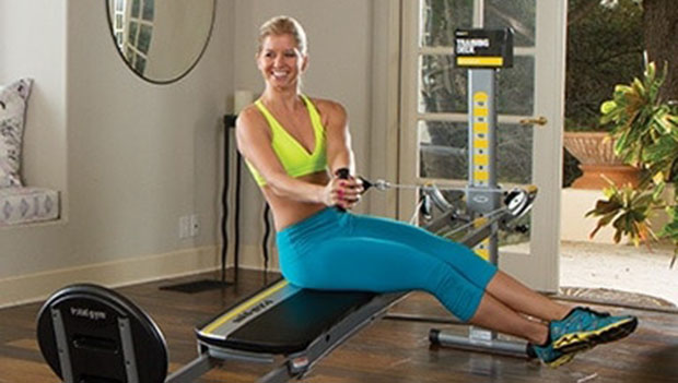 woman using a total gym system