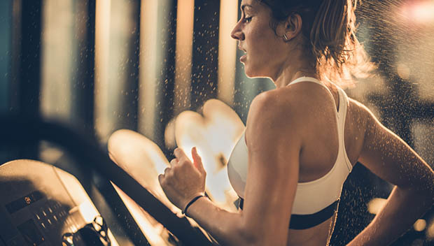 woman running on treadmill