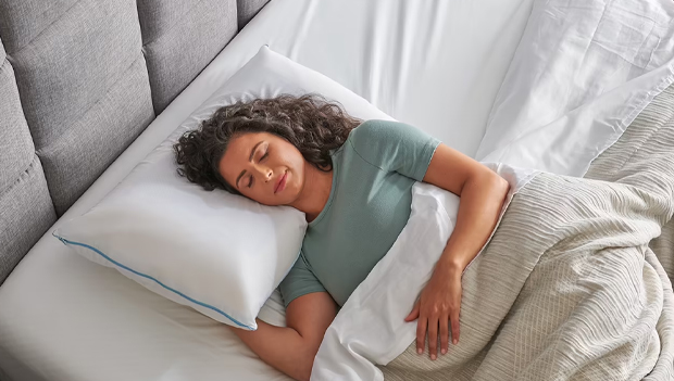 Woman using a cooling pillow