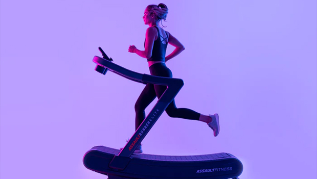 woman using curved treadmill