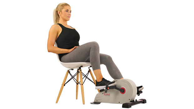 woman using under desk elliptical
