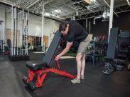 man using adjustable weight bench_front