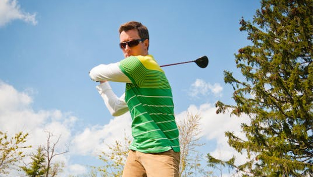 Man playing golf with sunglasses