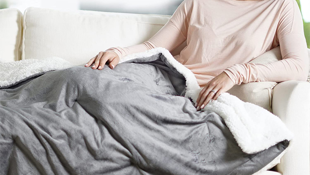 Woman using a heated Blanket