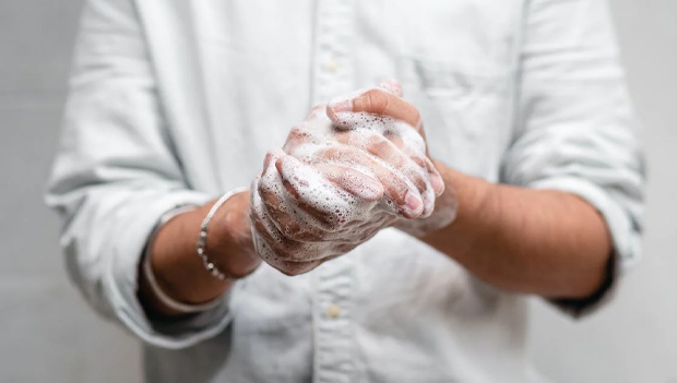 Person using soap on their hands