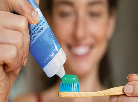woman with toothpaste