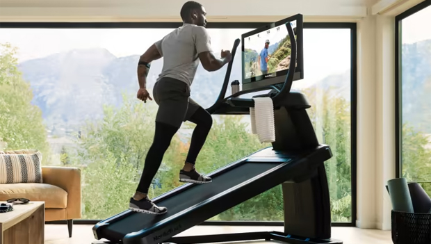 Man using NordicTrack Elite Treadmill