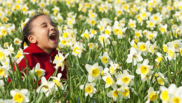 kid in daffodils