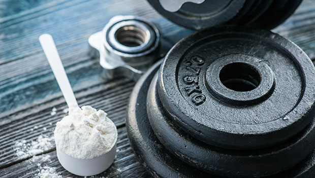 mass gainer with dumbbells and weights