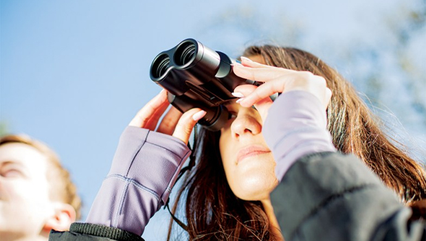 Woman using Binoculars