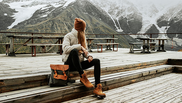 woman wearing winter boots at a lodge