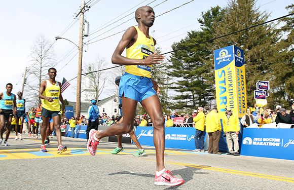 Wesley Korir, of Kenya, warms up prior to the start of the 117th running of the Boston Marathon, in Hopkinton, Mass. Korir had recently been elected to Parliament in his native Kenya. (AP Photo/Stew Milne, File)