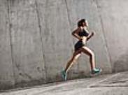 female runner on an incline-front