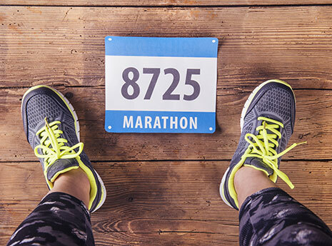 runners feat with marathon number