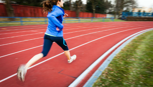 Woman Running on Track